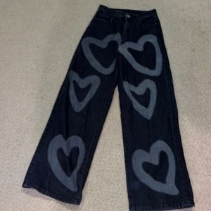 Black, wide leg jeans with hearts on the front